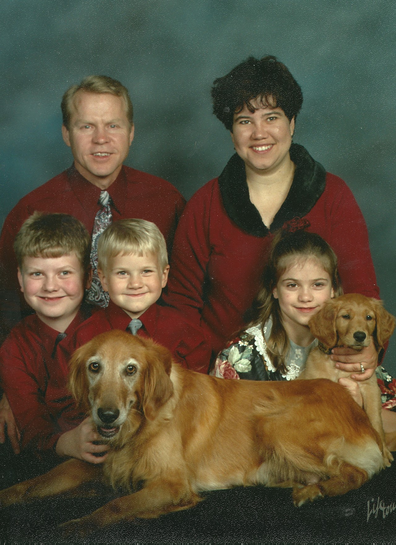 Dave and Ivy Anderson with their golden retrievers